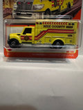 Yellow MBX County EMS 70 Years 38/100 International Workstar Ambulance HKW94 ©2023 Matchbox Diecast Car