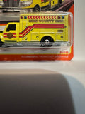Yellow MBX County EMS 70 Years 38/100 International Workstar Ambulance HKW94 ©2023 Matchbox Diecast Car