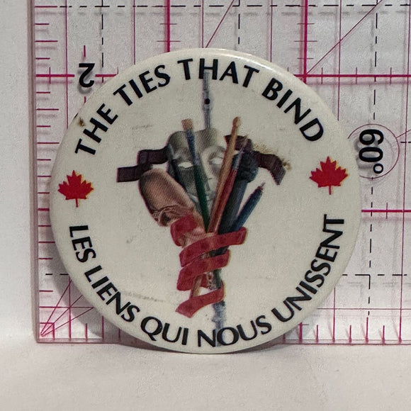 The Ties That Bind Les Liens Qui Nous Unissent Logo  Button Pinback