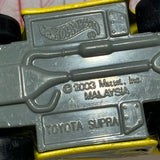 Yellow Toyota Supra Tooned Hot Wheels Diecast Car