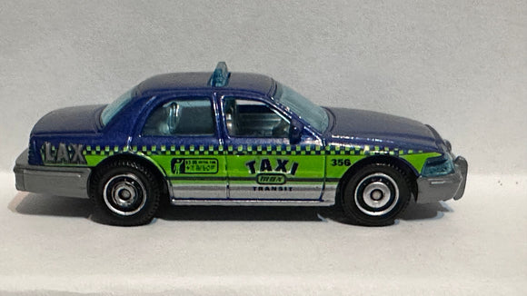 Blue Taxi 2006 Ford Crown Victoria Matchbox Diecast Car