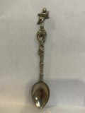 Person Carrying a Baby Souvenir Spoon