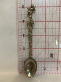 Person Carrying a Baby Souvenir Spoon