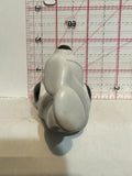 White Dog Black Ears Laying Down Figurine Ornament