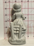 Lady Sitting on a Fence Figurine Ornament